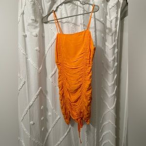 Worn twice. Scrunched. Bright orange.